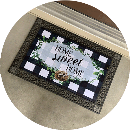 A door mat that says Home Sweet Home.